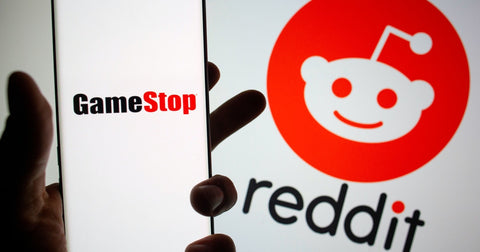 gamestop logo on phone with reddit logo in background 