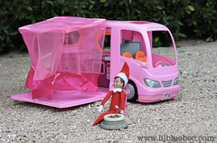 Elf on the Shelf driving barbies car