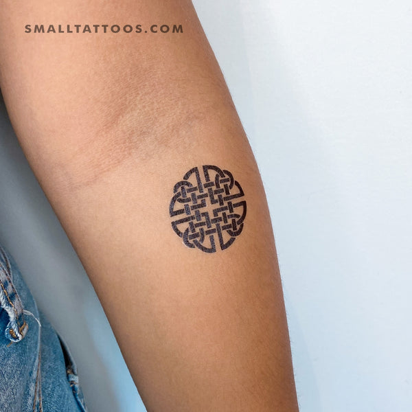 Small endless knot tattoo on the wrist - Tattoogrid.net