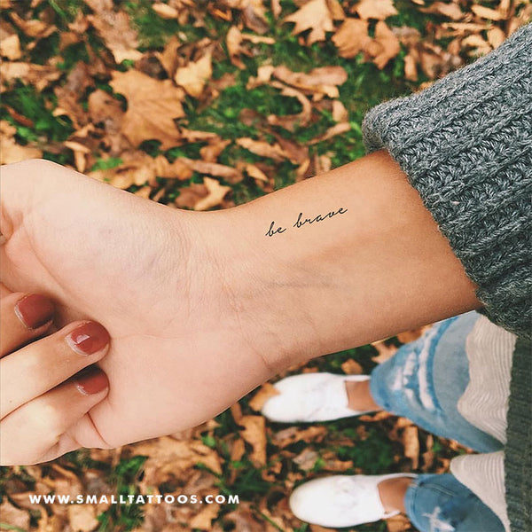 Courage tattoo on the right inner wrist