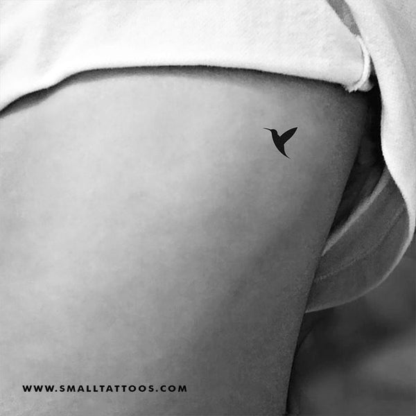 birds tattoo on ribs