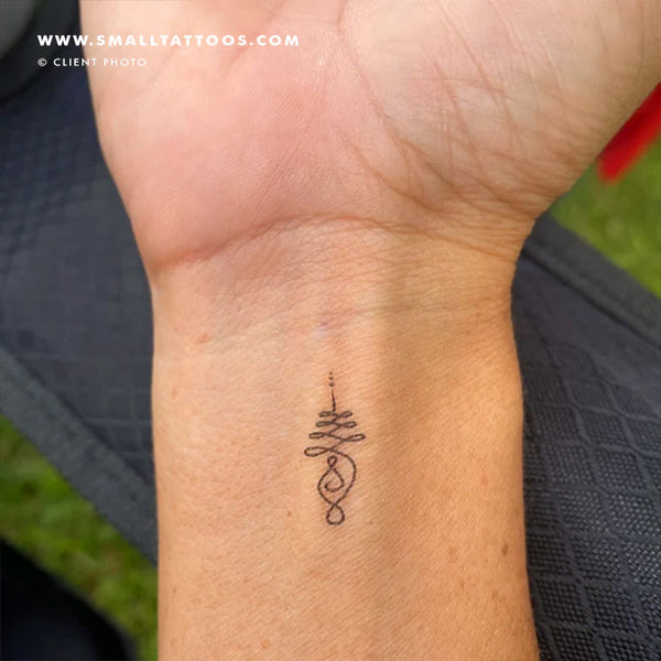 buddhist karma symbol tattoo