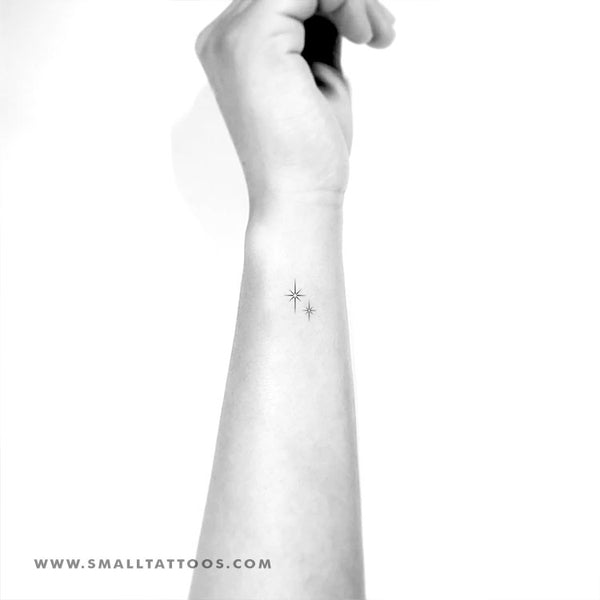 Minimalist North Star and hearts tattoo on the wrist