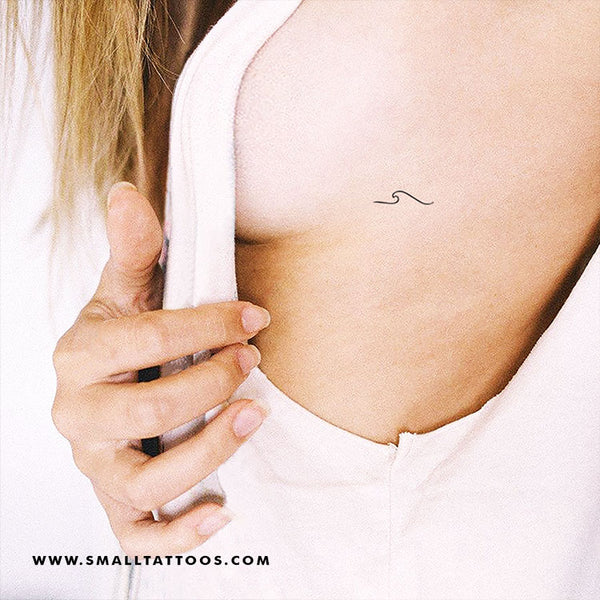 Small wave tattoo on the rib cage  Tattoogridnet