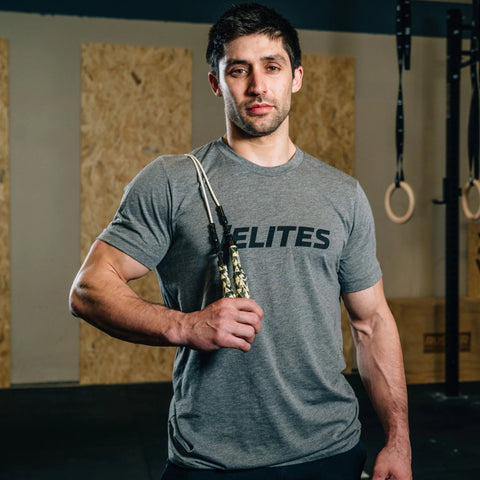 Velites jump rope on mans shoulder in gym