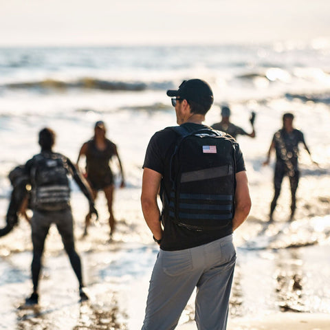 GoRuck backpack being worn on a beach