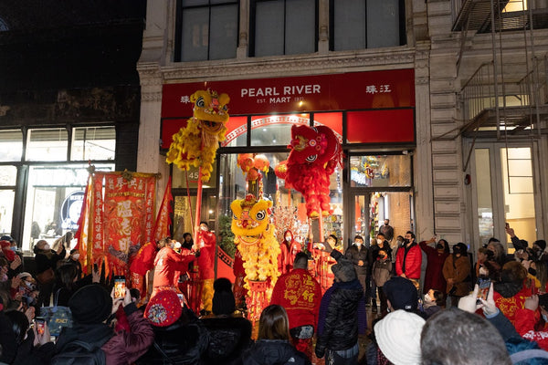 Lion dancing in front or Pearl River SoHo