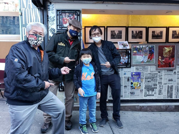 Corky Lee at his newsstand photo exhibit with Karlin Chan, Patrick Mock, and Griffin