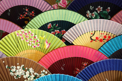 Arrangement of colorful folding fans