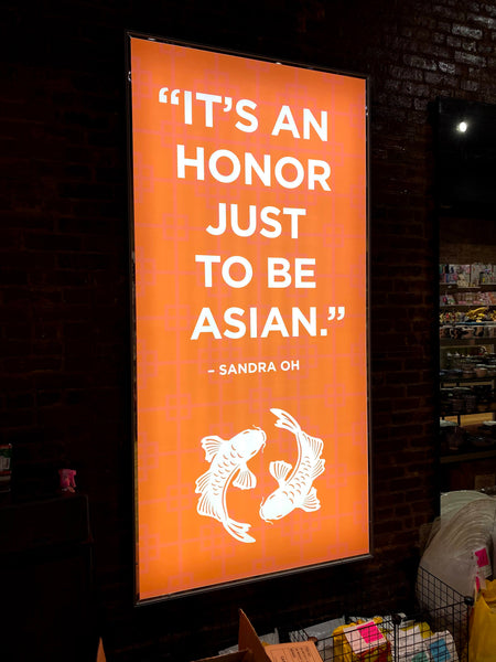 "Proud to be Asian" light box at 452 Broadway