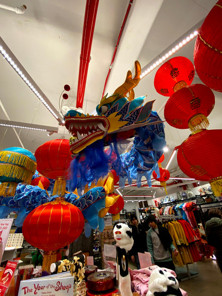 Pearl River Mart in-store display of blue dragon with lanterns and merchandise