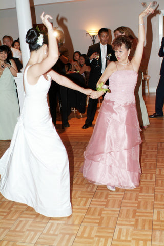 Bride dancing with mother at the reception