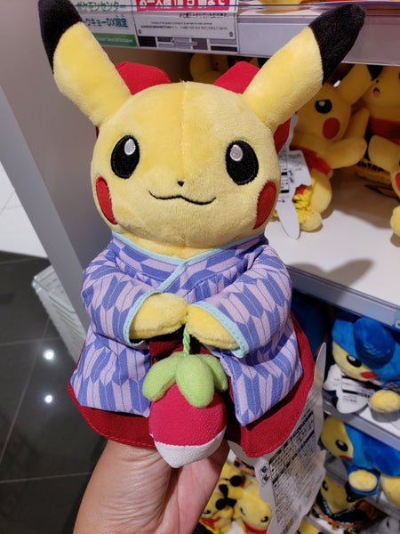 A Pikachu plushie in traditional kimono and hakama