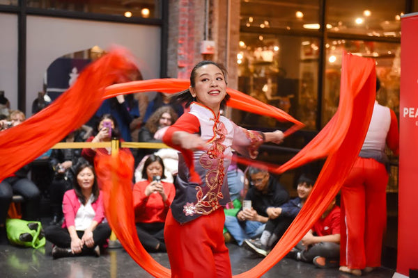 Ribbon dancer at Pearl River Mart's Lunar New Year celebration in Chelsea Market