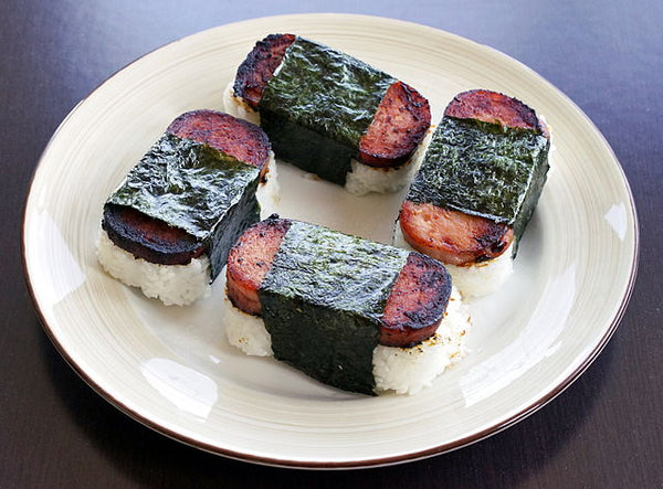 4 Spam musubis on a white plate