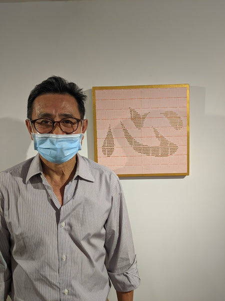 Artist Sung Ho Choi with his piece, "Mind"