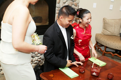 Bride and groom laughing during the tea ceremony