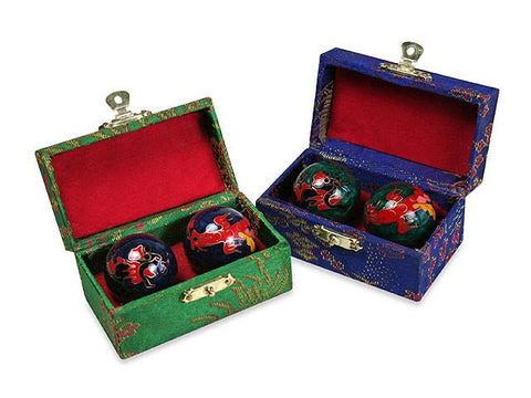Two boxes of cloisonne therapy balls