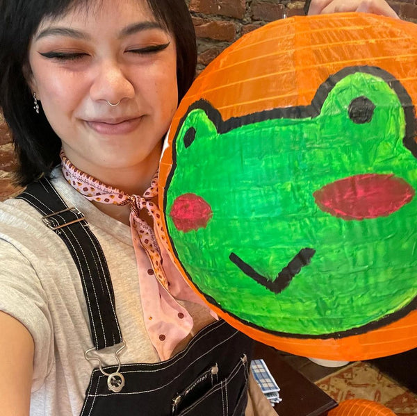 Vanessa Nguyen with her frog lantern