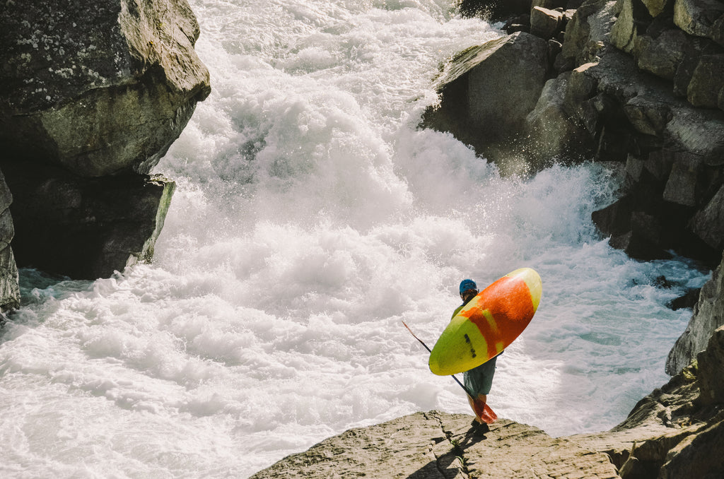 GEAR AID whitewater kayaker scoping line and holding boat that has been treated with UV Protectant