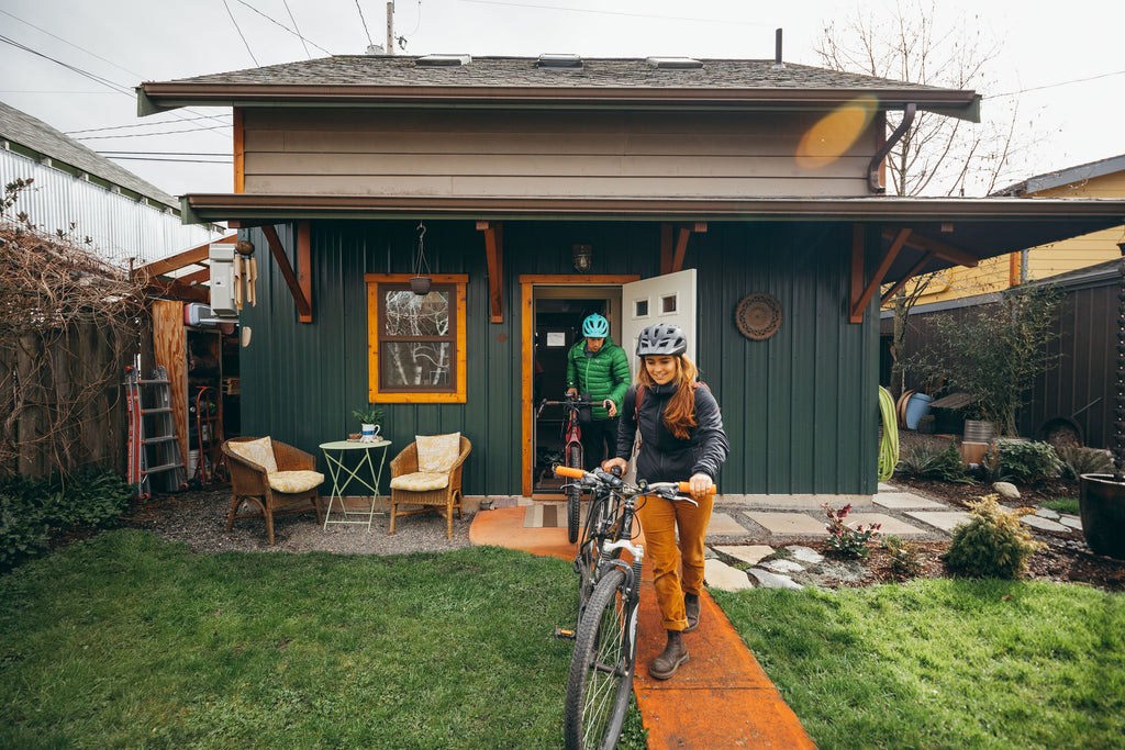 Two bikers leaving their house for a ride