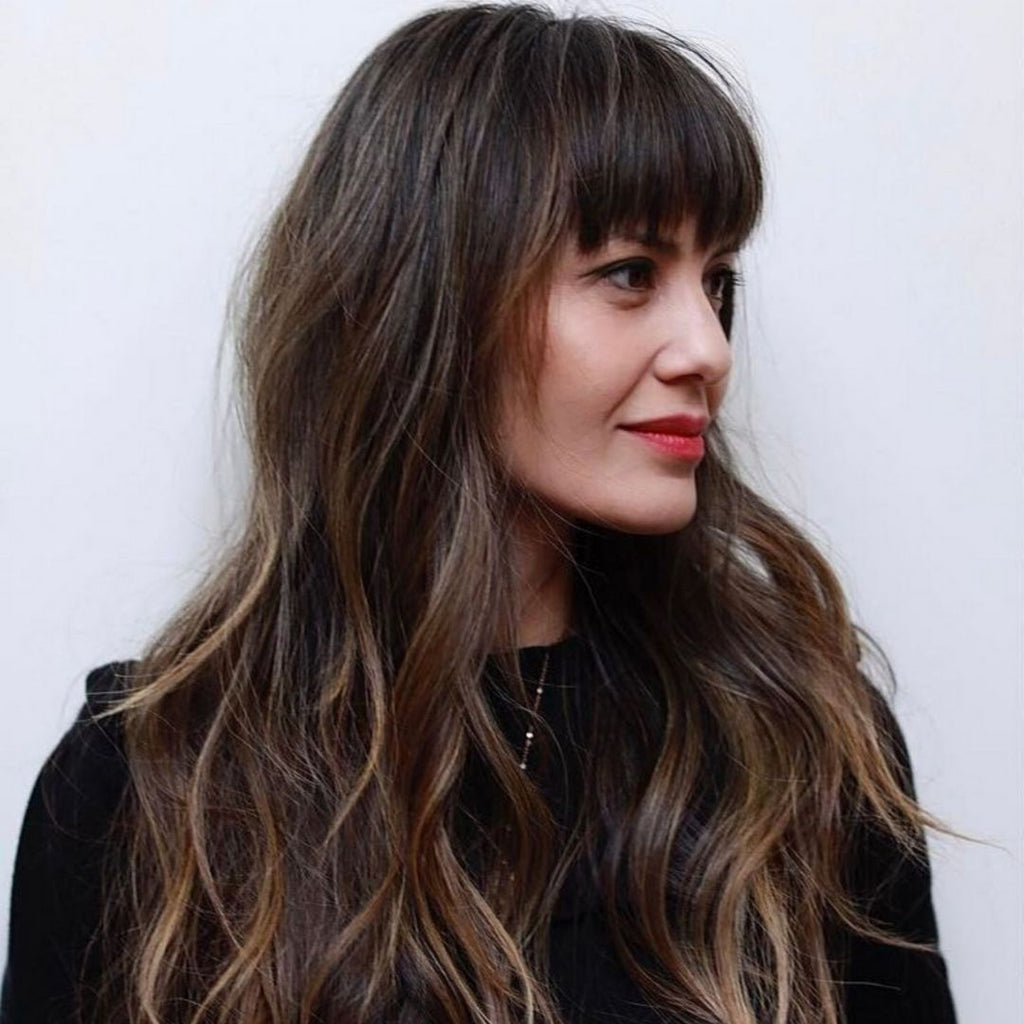 medium length wavy haircuts with bangs