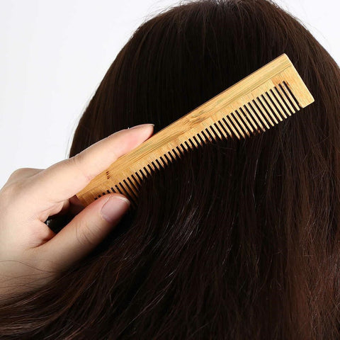 Gently brush your hair using the tail end of your comb
