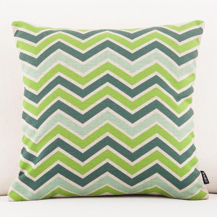 green and grey cushions and throws