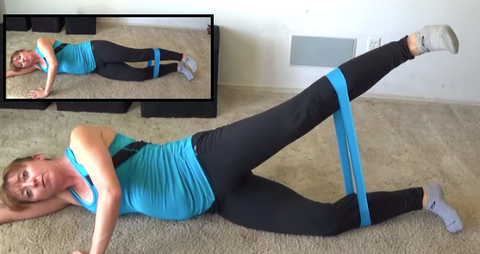 Female athlete using resistance band