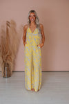 V-neck Halter Pocketed Floral Print Elasticized Waistline Jumpsuit