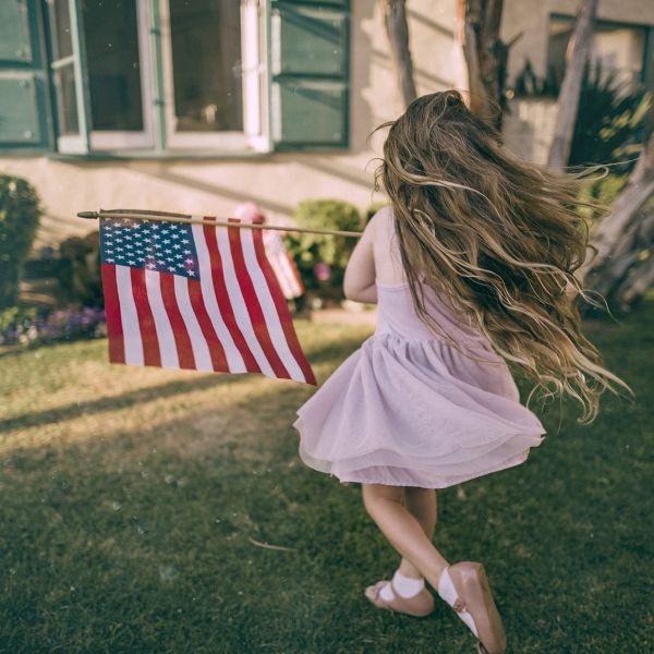 girl running with flag