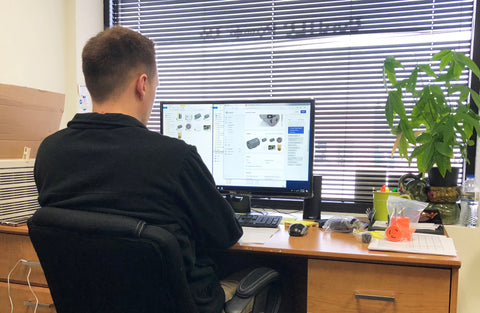 Christopher Hahn working on AC WORKS brand imaging at his desk. 