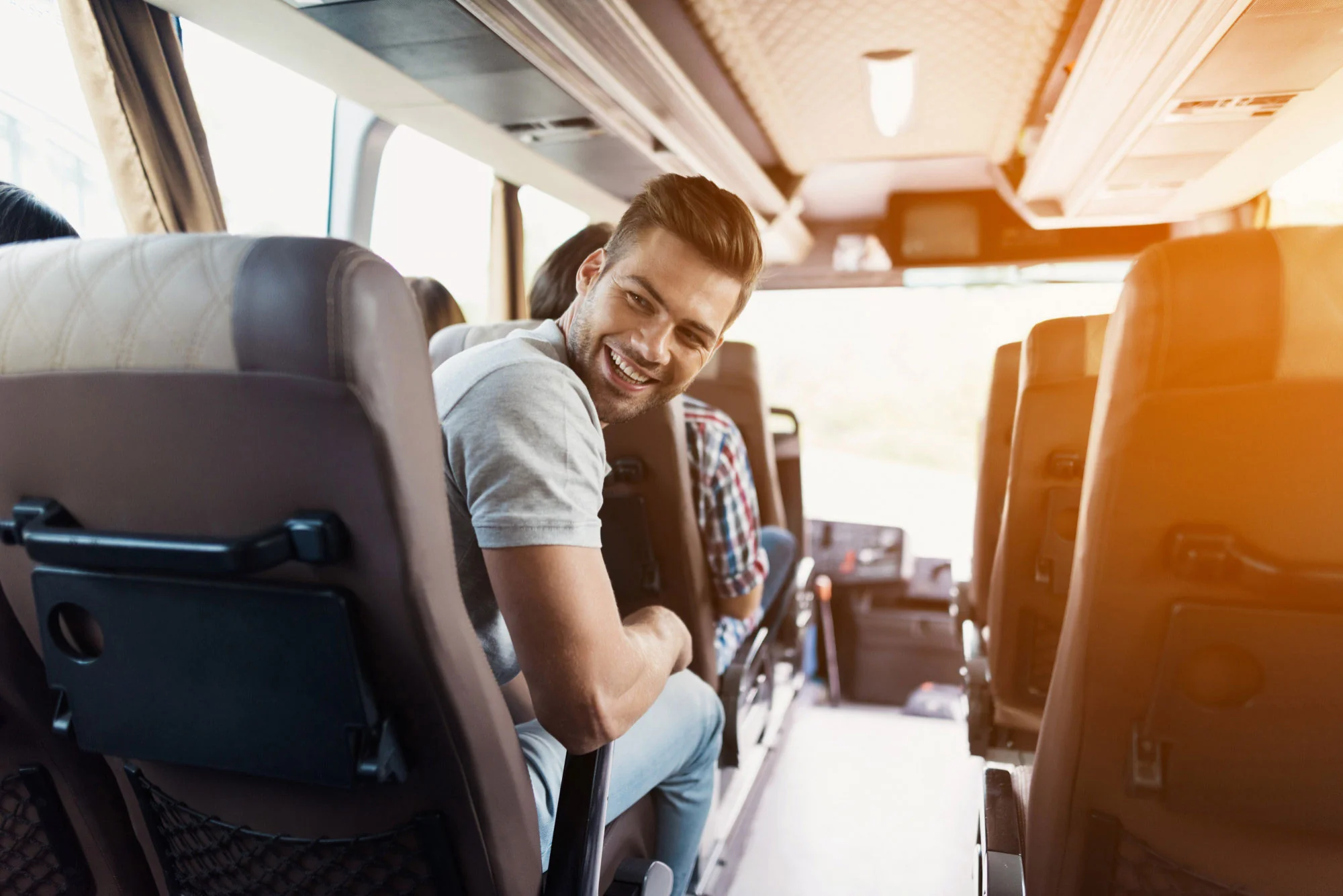 2-A-traveler-in-a-Merino-wool-shirt-boards-a-bus-between-destinations