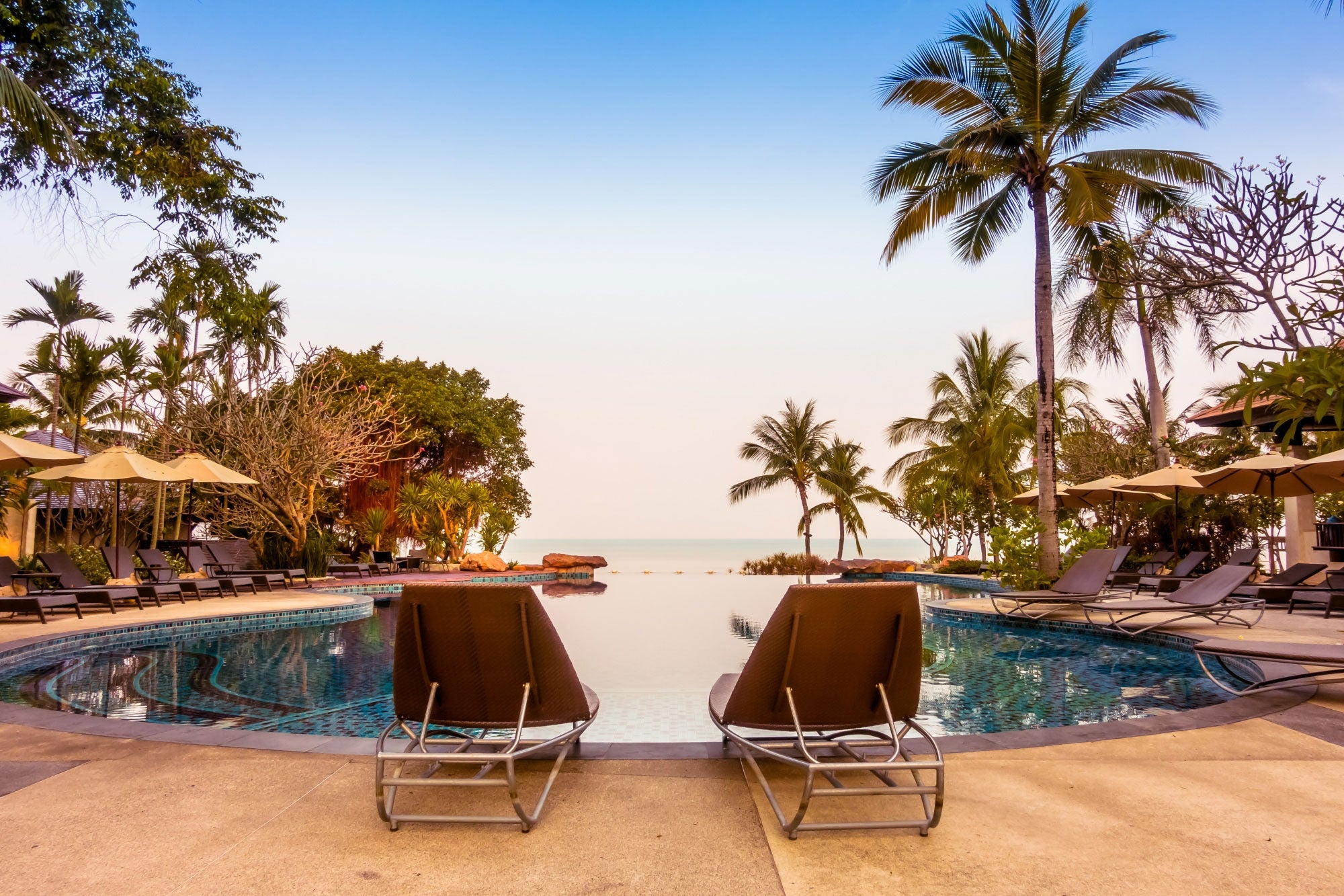 Couples-lounge-chairs-overlook-a-beach-resort