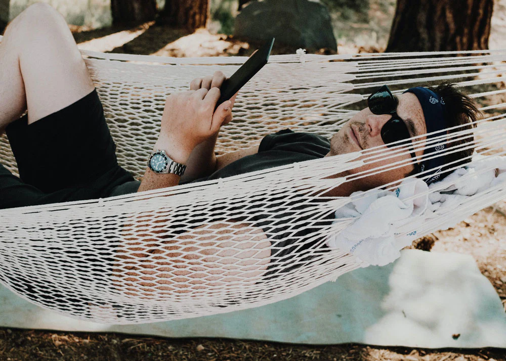 2 Man in Black Merino T Shirt Lounges in a Hammock