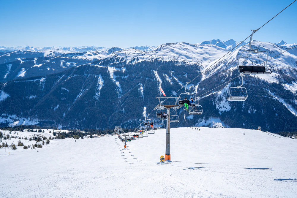 2 People skiing down a slope in the US