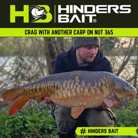 Craig with another Carp caught on Nut 365