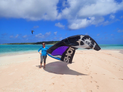 Woman preparing to go kite-surfing