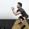 Man squatting with a resistance band