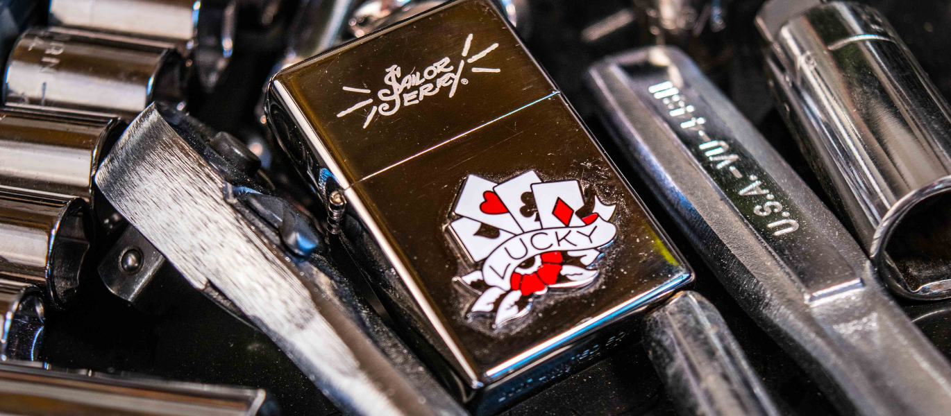 Silver Zippo lighter among tools