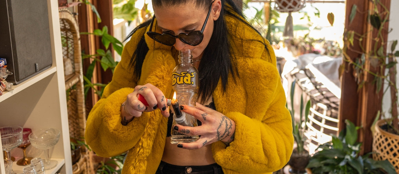 Woman Smoking Bud Bottle Bong