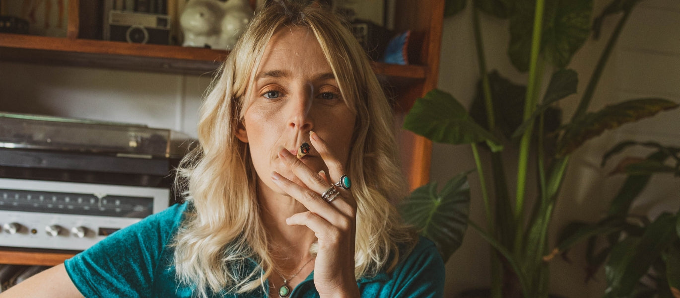 Woman smoking pre-rolled cone