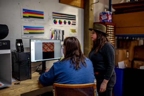 Western Sensibility Owners Katy & Conor work on  color profiles at their monitor