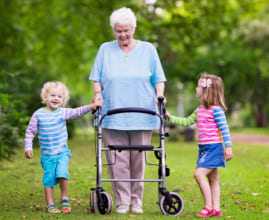 older lady with 4 wheeled seat walker