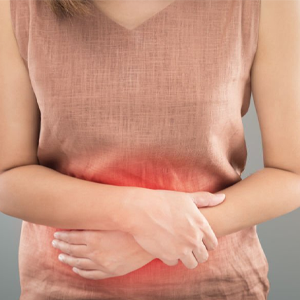 a woman with stomach problem has placed her hands on her belly