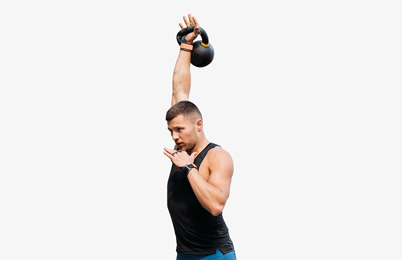 a man is lifting DMoose Kettlebell for strength building workout