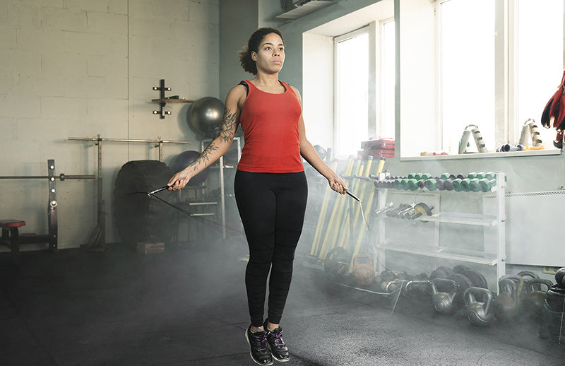 A woman using DMoose jump rope for skipping