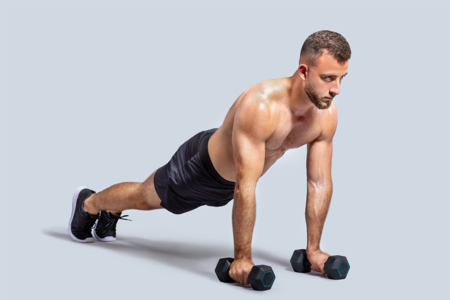 Dumbbell Plank Pass Throughs