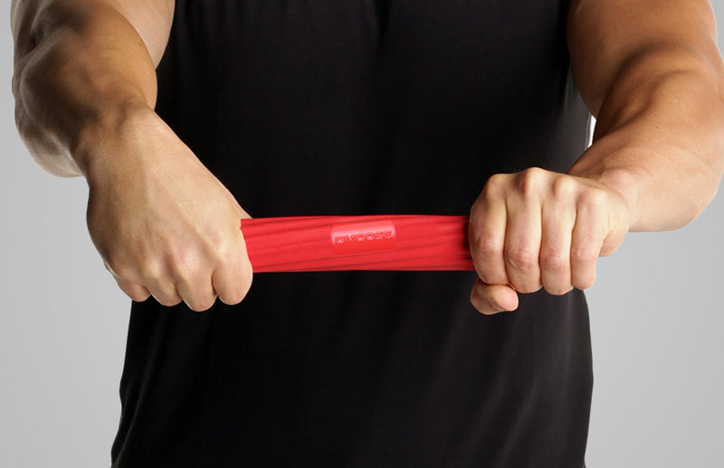 A man strengthening his arm muscles by using DMoose tennis elbow bar
