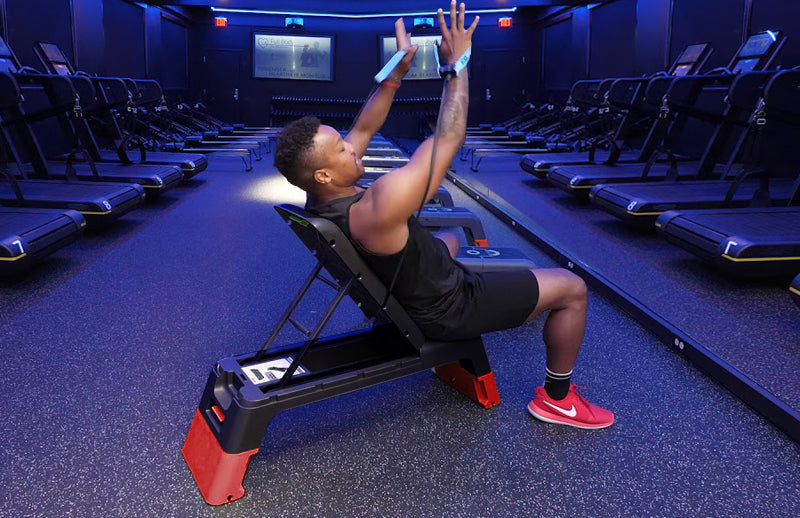 A man working out by using DMoose Fitness deck